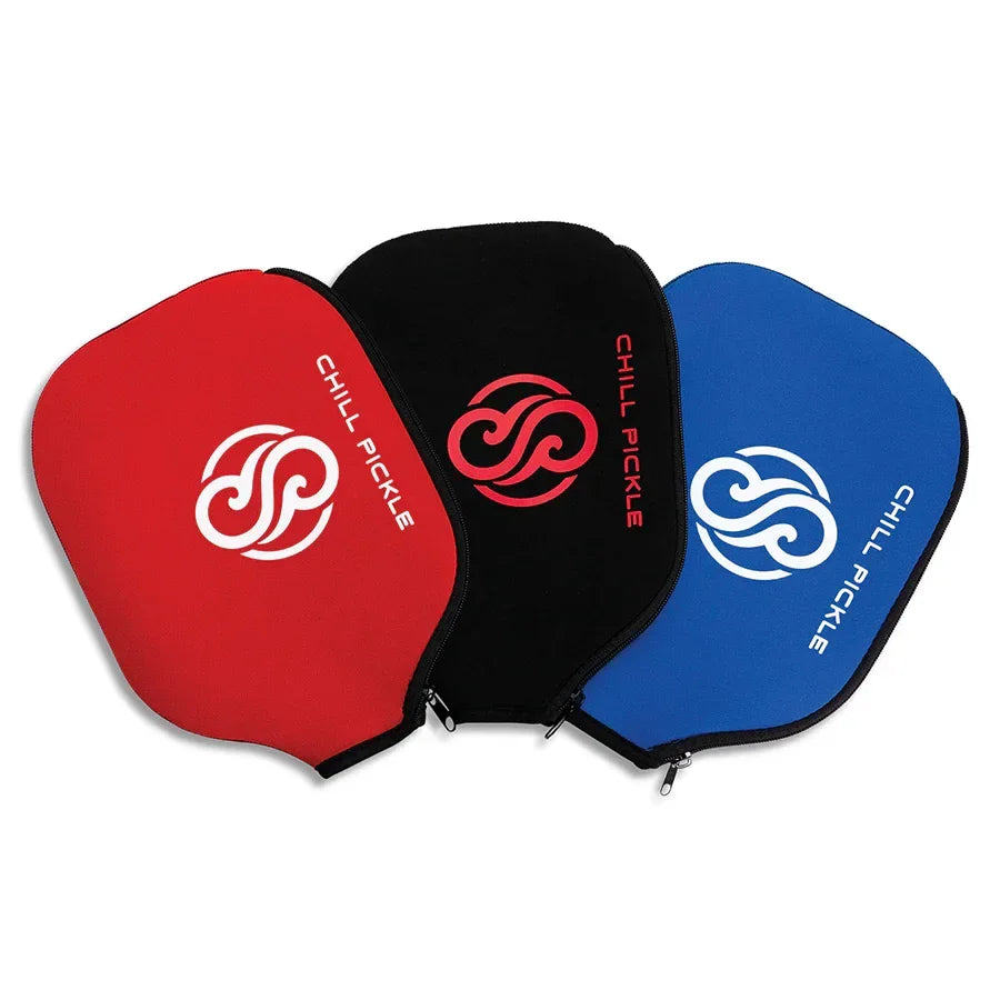 Three Chill Pickle pickleball paddle covers shown together in red, black, and blue color options