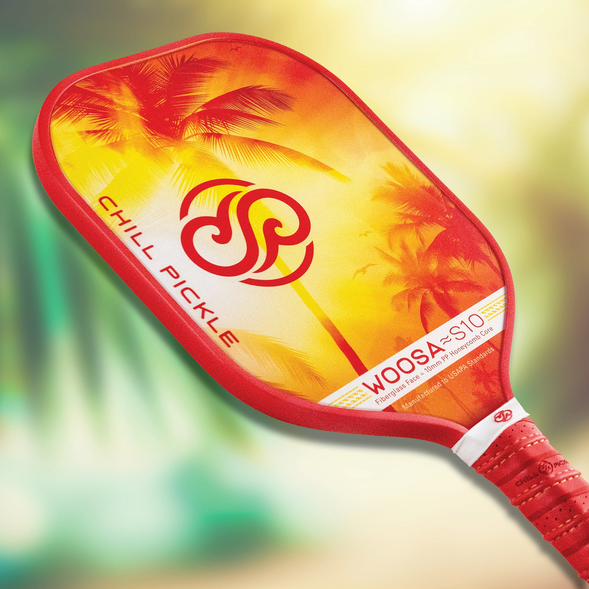 Beginner-friendly pickleball paddle Woosa by Chill Pickle, angled view with tropical sunset design