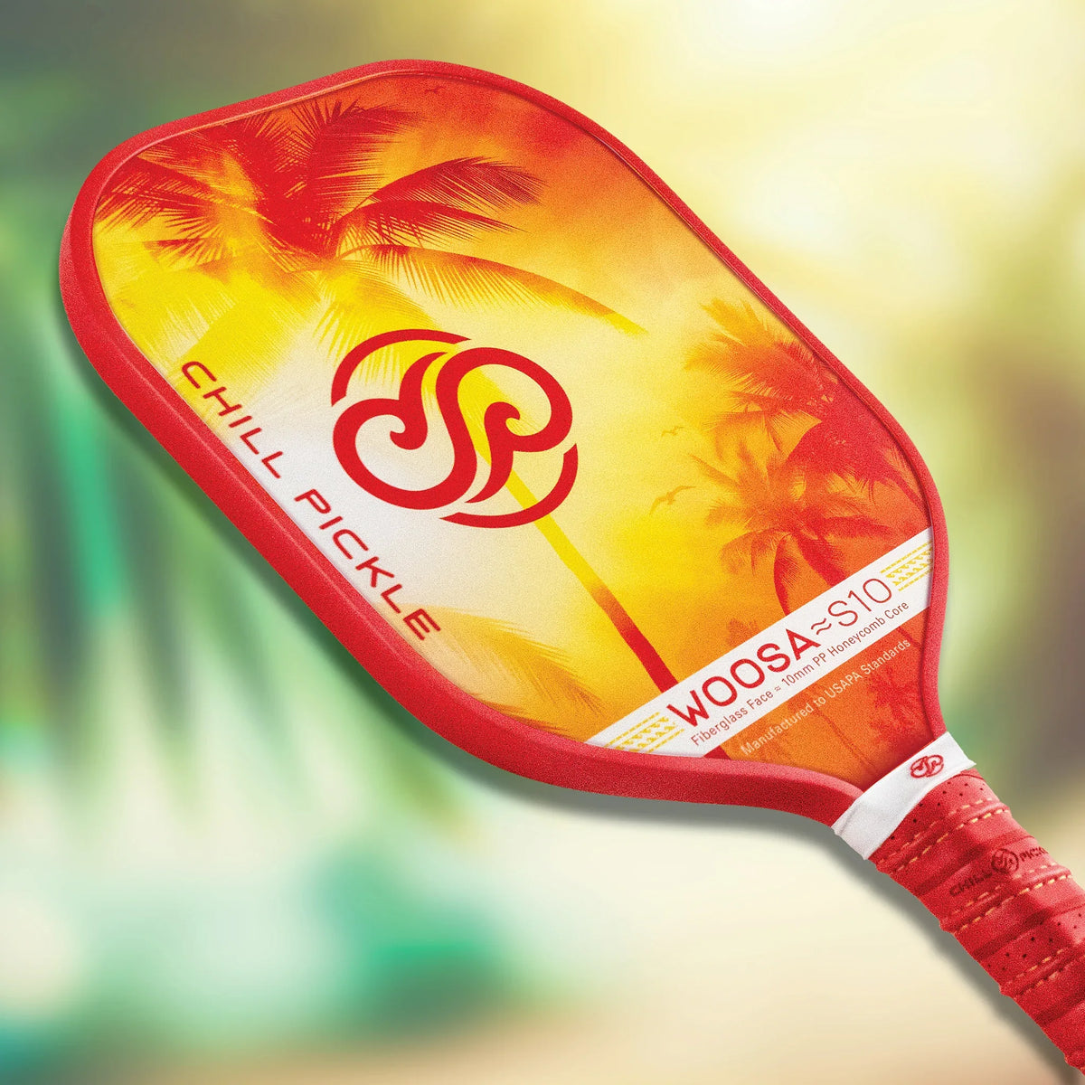 Beginner-friendly pickleball paddle Woosa by Chill Pickle, angled view with tropical sunset design