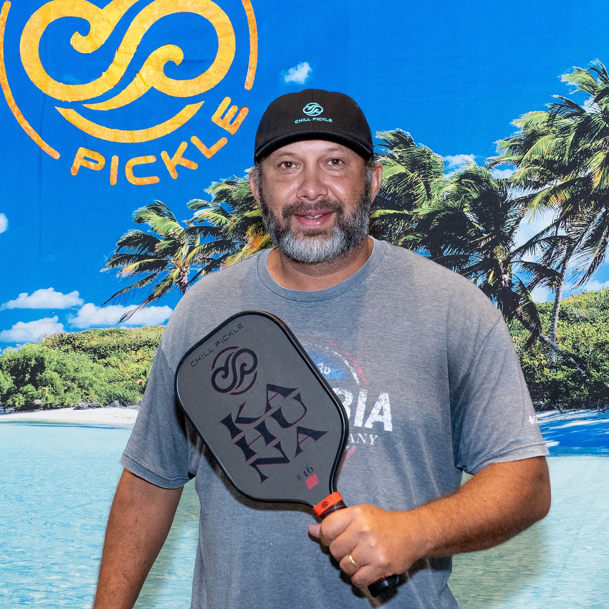 Pickleball player holding Chill Pickle Kahuna paddle outdoors during customer testimonial photo
